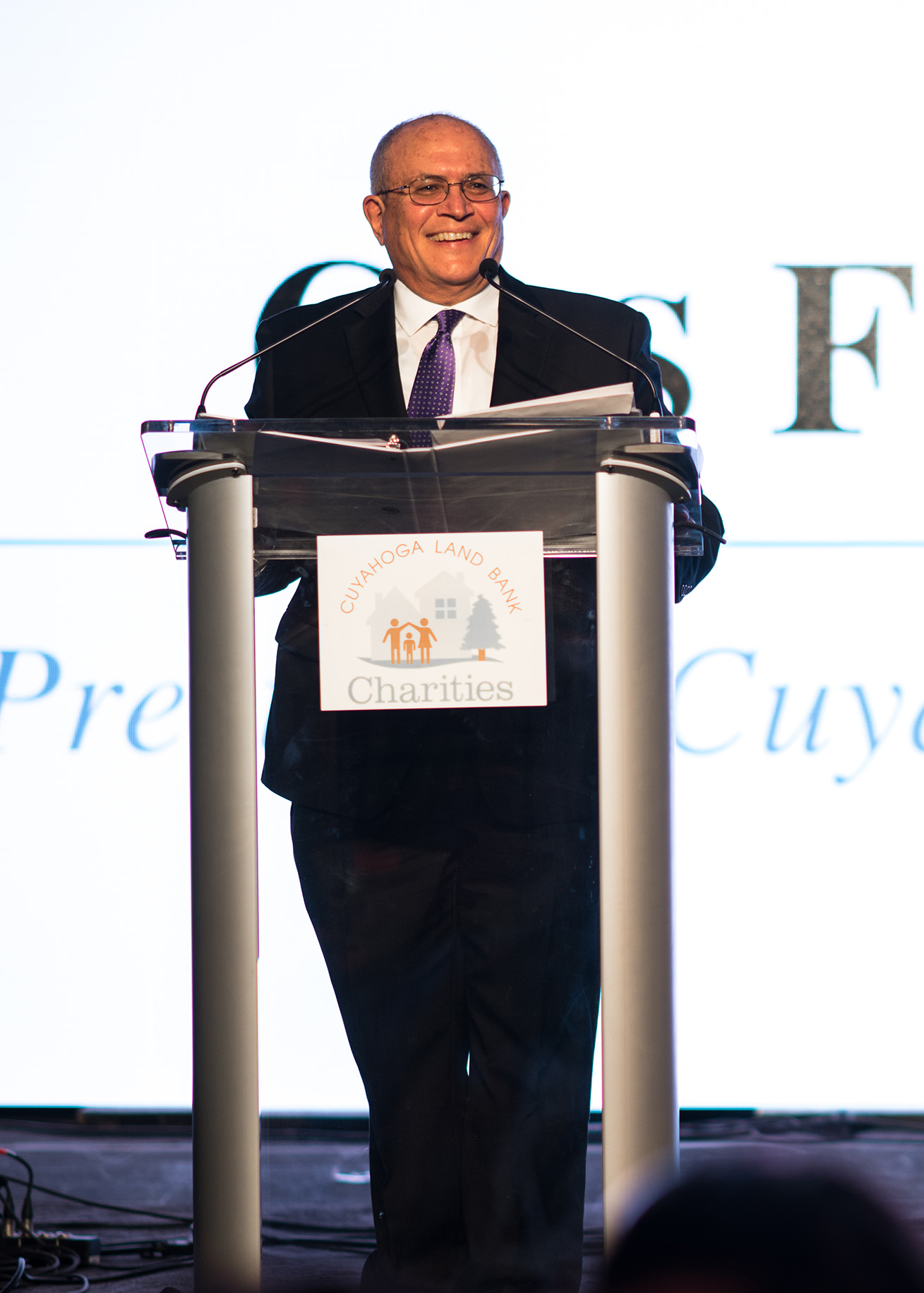 the late Gus Frangos, founder of the Cuyahoga Land Bank, speaking at a lectern